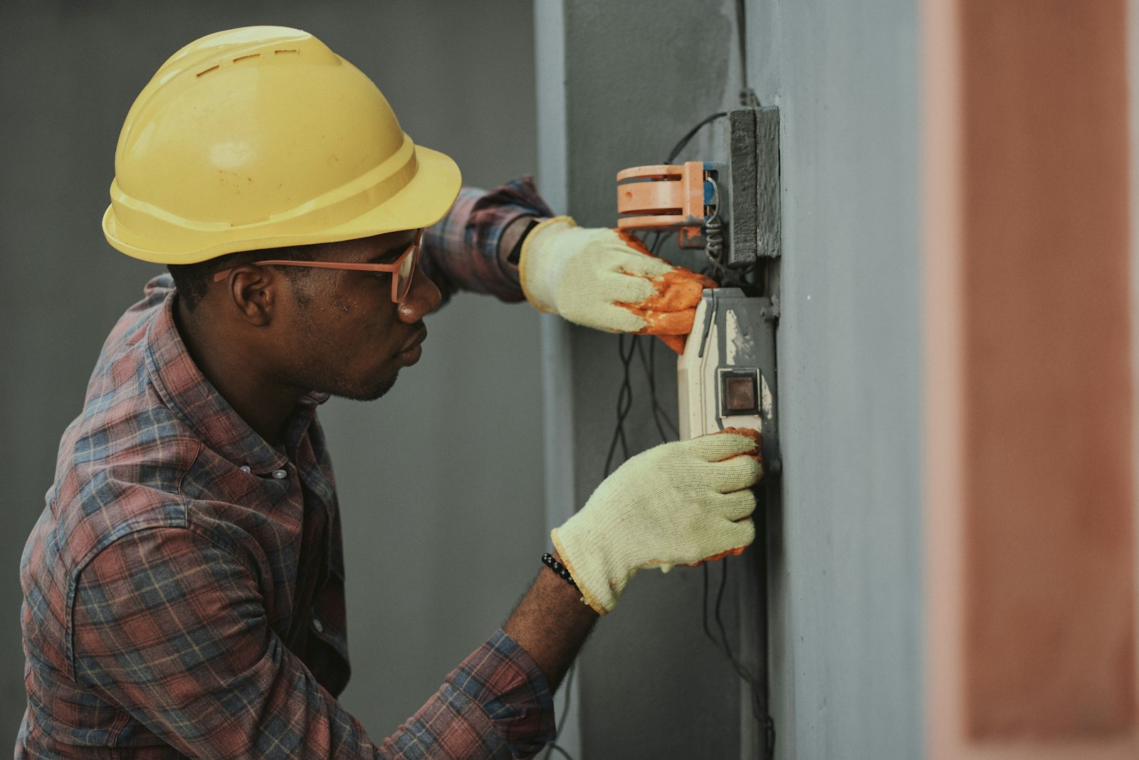 Electrician testing a distribution-board installation.