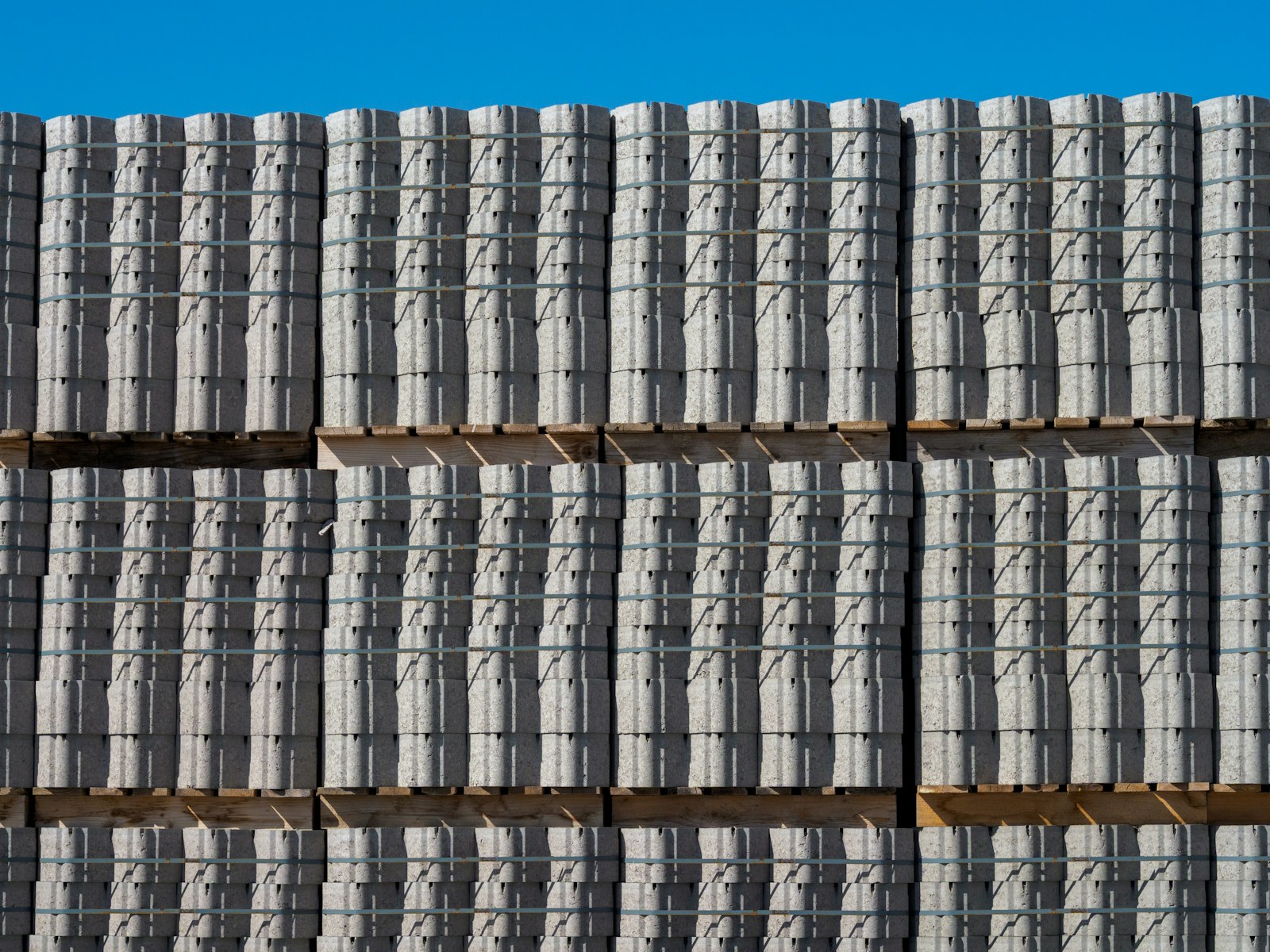 Stacked concrete blocks at a building-materials yard.