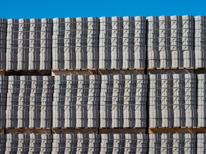 Stacked concrete blocks at a building-materials yard.