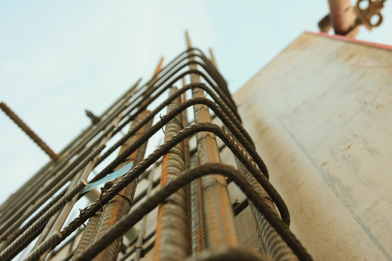 A reinforced concrete structure rising on a building site.