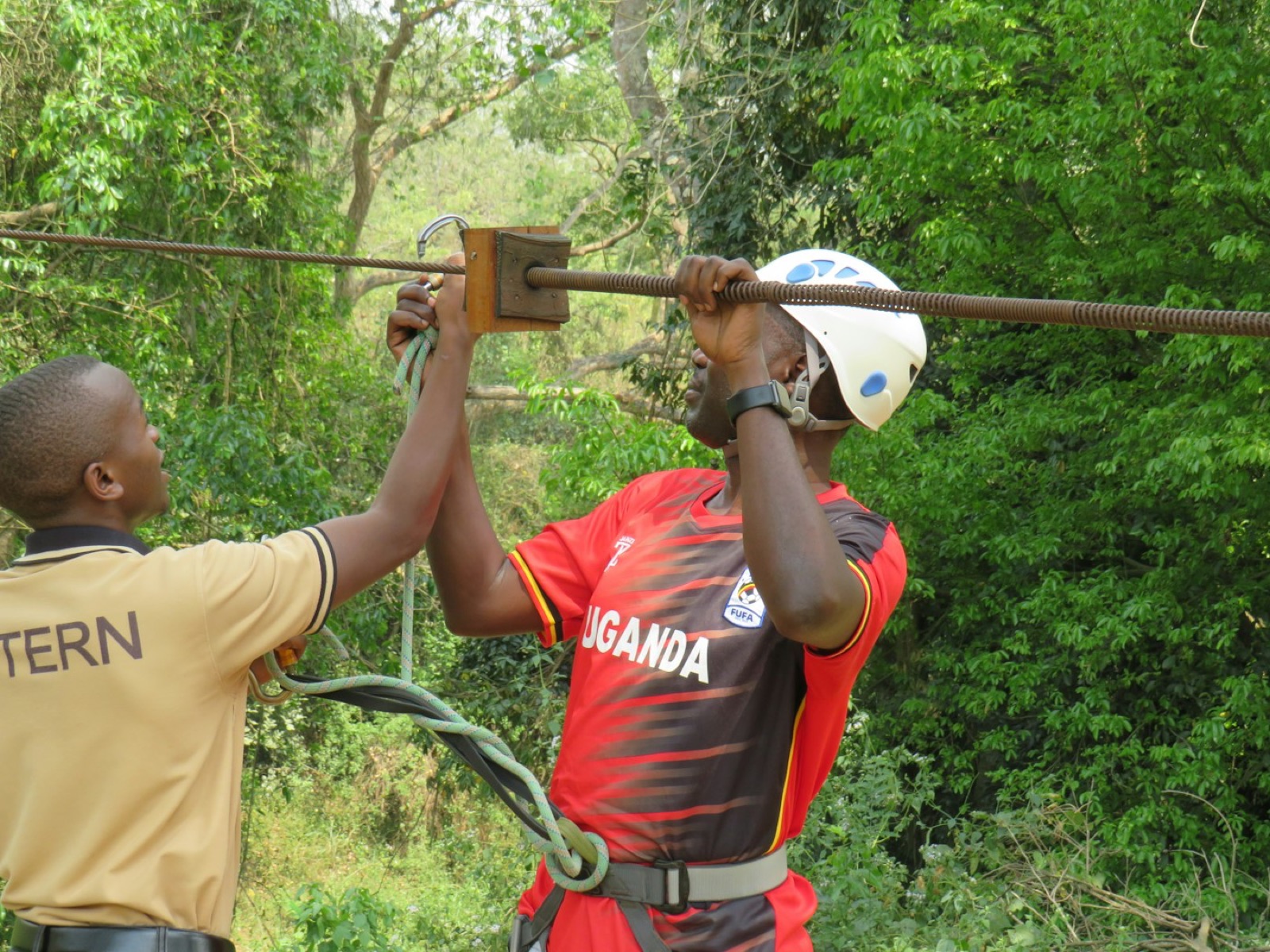 A BANEC intern fixing reinforcement alongside a senior site hand.