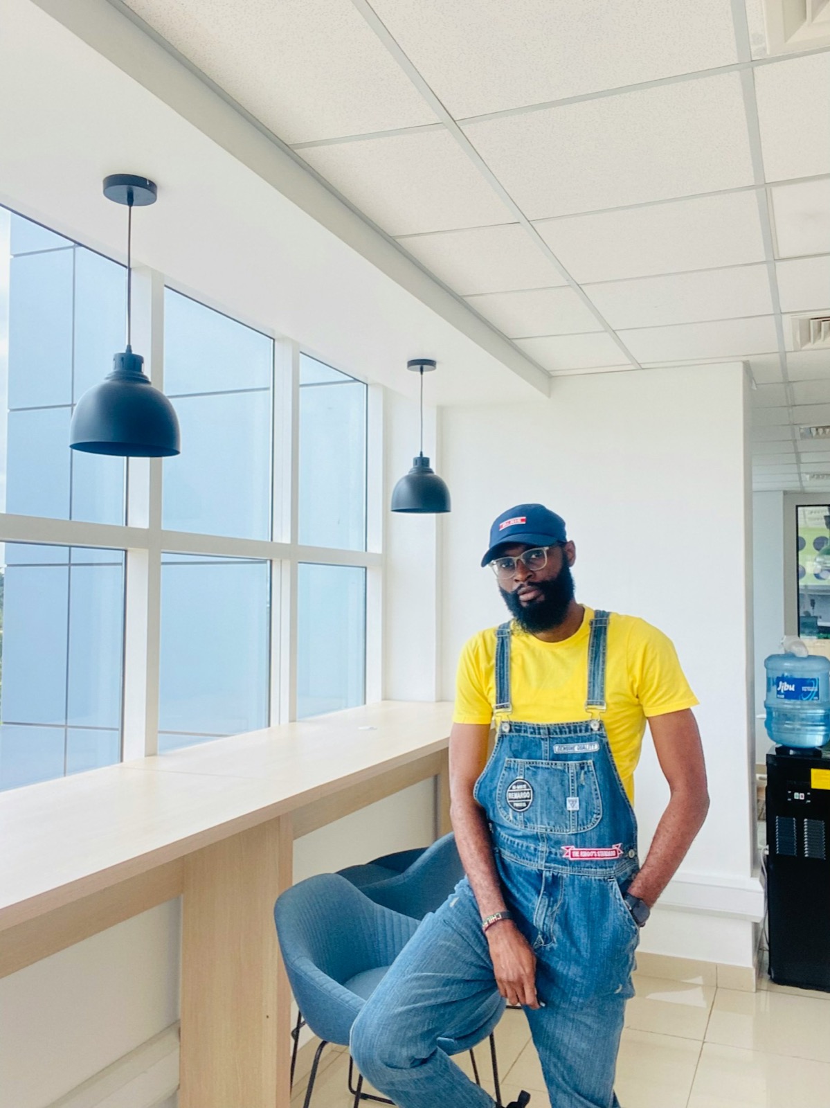 A young BANEC tradesman in work overalls.
