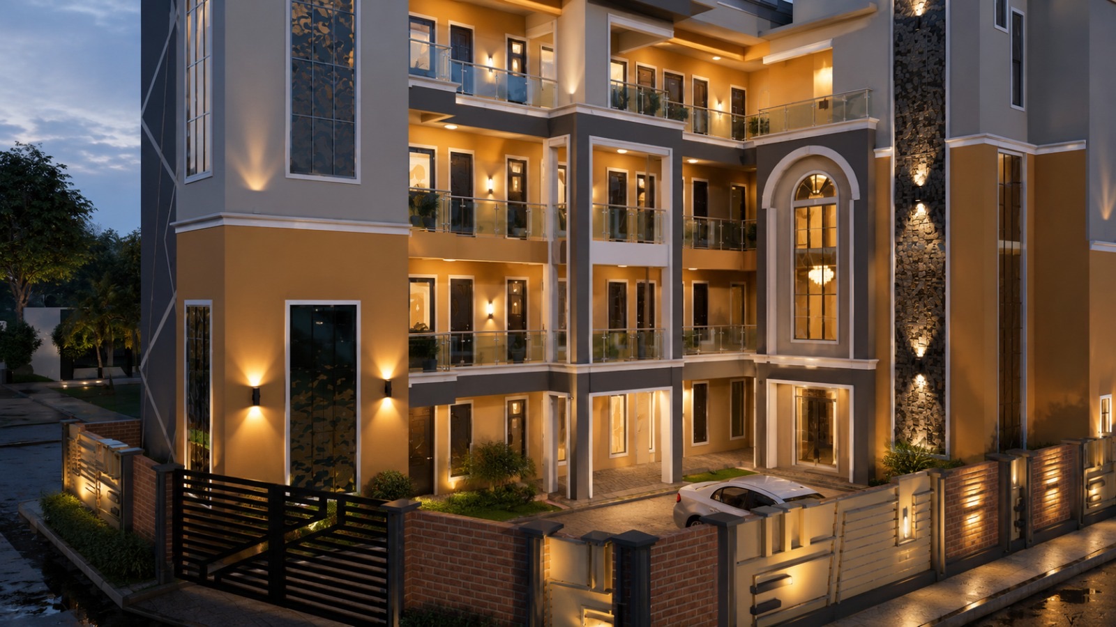 BANEC Engineering residential apartment block at dusk with tungsten elevation lighting.